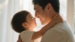 © KevinNandya - Father and Toddler Embrace in Soft Natural Light