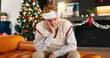 © peopleimages.com - Sad, senior man and house on Christmas, past reflection on lonely holiday and nostalgia memory. Thinking, elderly person and grief for cancelled plan, regret decision and emotional for festive season