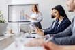 © Dusan Petkovic - Selective focus on businesswoman with tablet following seminar at boardroom.