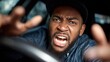 © Mykola - Frustrated Driver: African American Male in His 20s Expressing Anger and Stress in Car