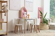 © New Africa - Contemporary furniture, toys and decor near white wall in stylish playroom. Interior design