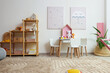 © New Africa - Contemporary furniture, toys and decor near white wall in stylish playroom. Interior design