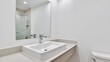 © Ayahe Stock - Clean, modern bathroom showcasing a white sink, large mirror, and bright, minimalist design style.