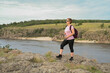 © Ольга Калинчук - female tourist walking with backpack on beach and rocks