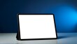 © Lynn - an ipad standing horizontally showing a white screen on a table blue lighting background inside a room of artist