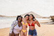 © Sabrina - Young multiracial women with different bodies walking on the beach during summer vacation - Diverse latin girls having fun together outdoor