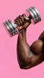 © OleksandrZastrozhnov - Strong african male lifting dumbbell against pink background