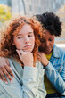 © Jose Calsina - Two caring young women engage in a deep moment of reflection and emotional support while sharing their thoughts and feelings with each other in a close and intimate setting.