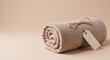 © Deamard - Soft-colored towel bundled neatly with rustic jute twine and blank label