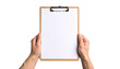 © photostockatinat - Two hands holding a clipboard with a blank sheet of paper. The clipboard is light brown, and the paper is white.