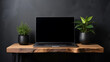 © StockClarity - Dark Gray Wall Minimalist Workspace Laptop Black Pots Green Plants Wooden Table computer