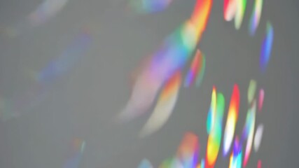 Wall Mural - colorful light refractions creating dynamic abstract patterns on grey background