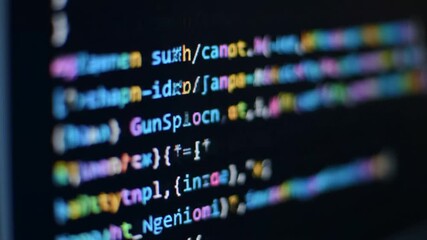 Colorful Blurry Code on a Dark Monitor Digital Text with Artificial Intelligence