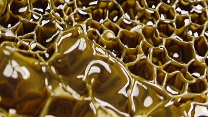 Wall Mural - golden honeycomb pattern reflecting light in detailed abstract closeup imagery