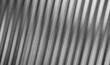 © Uuganbayar - Slatted glass background black and white color. Fluted texture with fine grain, soft blur. Modern abstract blurred background for digital design, banners, web visuals, branding projects