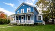 © Kitra - Vibrant blue house with porch under a partly cloudy sky