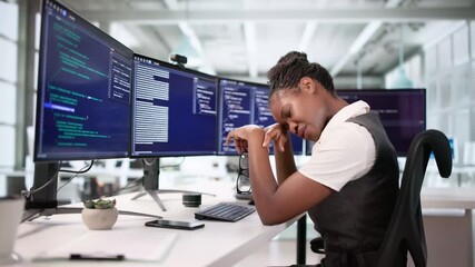 Female Engineer Frustrated With Coding At Her Desk