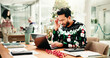 © peopleimages.com - Headache, Christmas and man in office with laptop for stress, burnout or fatigue for workload. Exhaustion, tired and male financial advisor with migraine for documents and computer in festive season.