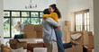 © peopleimages.com - Hug, success and moving with couple in new home for property, support and mortgage approval. Real estate investment, celebration and relocation with man and woman in living room for house purchase