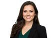 © Laki - A confident young professional woman with long dark hair smiling, wearing a black blazer, isolated on transparent background