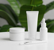© Alingga - Plain white skincare with a green leaf background, looks clean, minimalist, and natural.