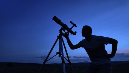 Wall Mural - amateur astronomer using telescope for watching stars, moon, planets and other celestial objects fro