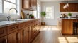 © Ayahe Stock - Warm kitchen showcasing wood cabinetry with ample counter space illuminated by natural window light