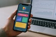 © Generative AI - Modern smartphone displaying advertising app interface with marketing and analytics icons.