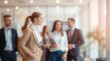 © Lira - Business office with blurred people casual wear, with blurred bokeh background