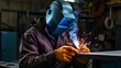 © 행운 행 - 보호도구 헬멧과 장갑을 끼고 용접하는 남자a man who welds with a helmet and gloves for protective equipment