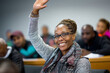© Olha Havelia - african american Student raising hand in adult literacy class, multicultural setting, positive atmosphere,
