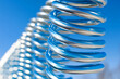© pavlofox - Metallic springs dance beautifully against the blue sky