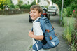 © Kristina89 - Portrait of a schoolboy with a backpack on the street. Back to school. Studying.