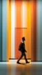 © Valentyna Prudnikova - A solitary figure walks purposefully through a vibrant corridor of warm orange and yellow vertical stripes, creating a dynamic visual journey of movement and color contrast.