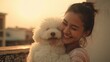 © Surachetsh - A joyful woman and her fluffy dog share a loving embrace in an outdoor setting, posing together for a lively selfie full of warmth.