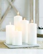 © MD - White Pillar Candles on Tray with Warm Flame – Minimalist Home Decor and Cozy Interior Atmosphere for Relaxation and Zen Vibes