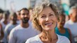 © Farah - Smiling Mature Woman Runner Active Healthy Lifestyle Portrait Activewear Outdoors Summer Sunlight Positive Energy Fitness Marathon Race Competition Happy Expression