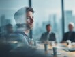 © Rifqi - Pensive businessman looking out the window during meeting in modern office space with colleagues, concept for corporate planning, executive leadership and innovative strategy session for management