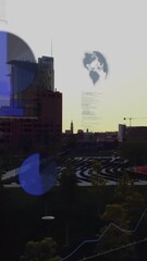 Wall Mural - Graphs and world map animation over urban park with modern buildings at sunset