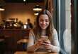 © Raphael - Smartphone Moment: A serene moment captures a woman engrossed in her smartphone within a cozy cafe, the warmth of the indoor ambience enhances the experience