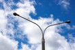 © Vera Aksionava - A street light stands tall against a cloudy blue sky during evening