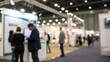 © N7 - Conference booth lights glowing through people blur — industry exposure and exchange