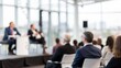 © N7 - Blurred Corporate Panel Discussion — Business leaders speaking with audience in soft focus