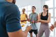 © oneinchpunch - Multiethnic group of sportive people doing functional workout at the gym, concepts about sport and fitness - Athletes training for strenght and cardio