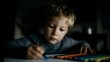 © Thares2020 - Young boy intently drawing a rocket with colored pencils at home