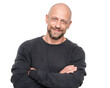 © Majnur - Smiling bald man with crossed arms isolated on transparent background