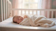 © jane - Newborn baby peacefully sleeping in a crib, wrapped in a soft blanket.