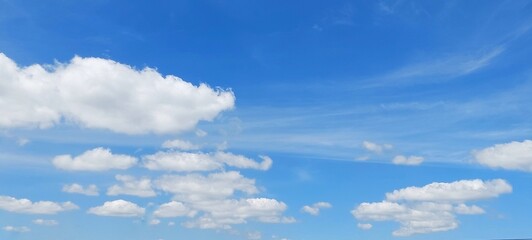Wall Mural - Sky panorama clear blue with white clouds in spring. Cloudscape