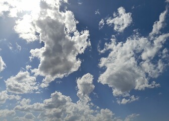 Wall Mural - photo of a partly cloudy and slightly sunny sky