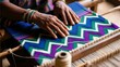 © Teerada - Artisan Weaving Colorful Textile on Traditional Loom